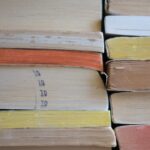 A stack of well-worn paperback books.