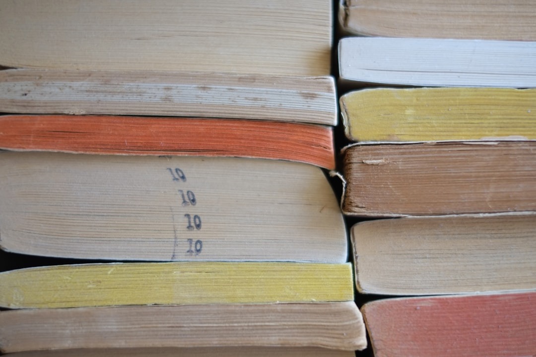 A stack of well-worn paperback books.