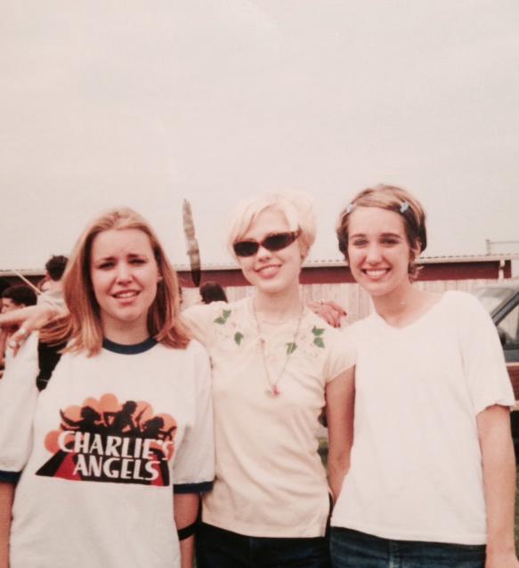 Three '90s teen girls at a music festival.