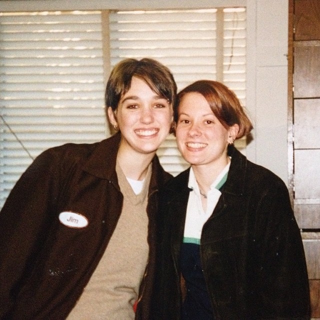 Two young women in a 1990s dorm room, one wearing a thrifted jacket, capturing early college life and independence